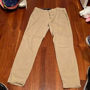 Cute stretchy khaki pants with elastic waist. Sits at belly button line.